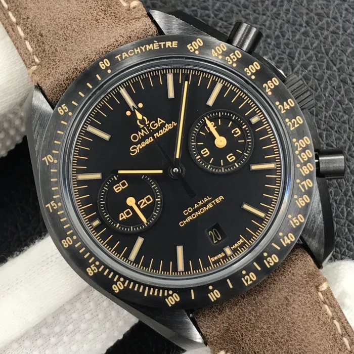 Close-up of the black dial, beige subdial hands and the date window