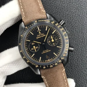 Held in a white glove, black dial with beige markers and hands