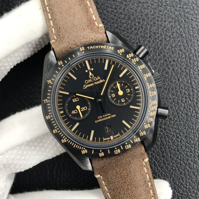 Held in a white glove, black dial with beige markers and hands