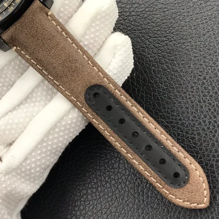 Tail of the brown suede strap with a black lining