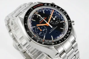 Three quarter view of the blue dial and orange hour and minute hands