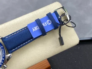 Blue strap and pin buckle with a blue tag attached