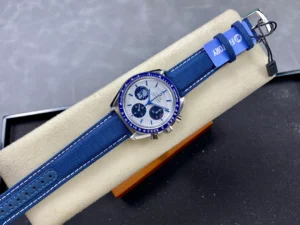Whole watch on a cushion with a blue hang tag on the strap