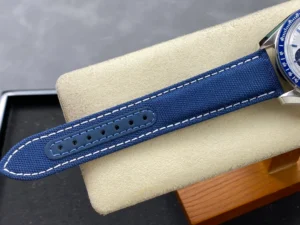 Tail of the blue fabric strap resting on a cushion