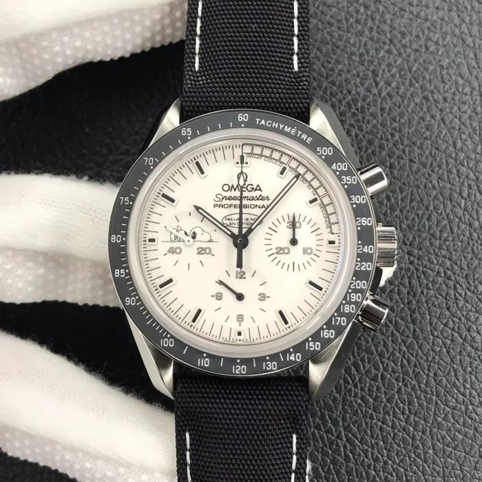 Full front view with the dark grey tachymeter bezel and black strap