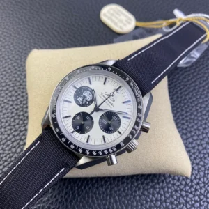 Front view on a cushion with a cream Omega tag behind
