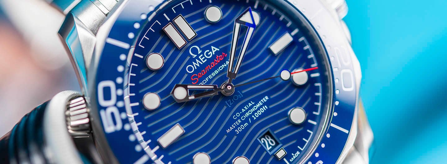 Omega Seamaster Diver 300M Blue Dial Macro Wave Pattern Ceramic Bezel Close Up Omega Seamaster Diver 300M Blue Dial Macro Wave Pattern Ceramic Bezel Close Up